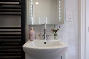 Complete with motion-sensor backlit mirror.