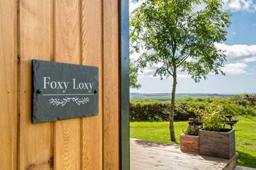 There are gorgeous far-reaching views over countryside to the sea in the distance.
