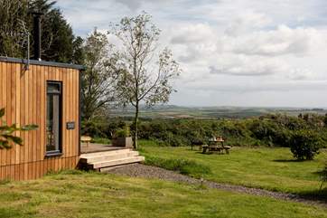 Rolling countryside to the sea beyond.
