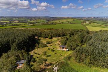 Foxy Loxy (on the right) and Squirrel Nutkin (far left) are surrounded by glorious countryside.