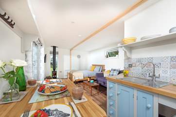 Spacious and open plan, the warming wood-burner ensures year-round cosiness.