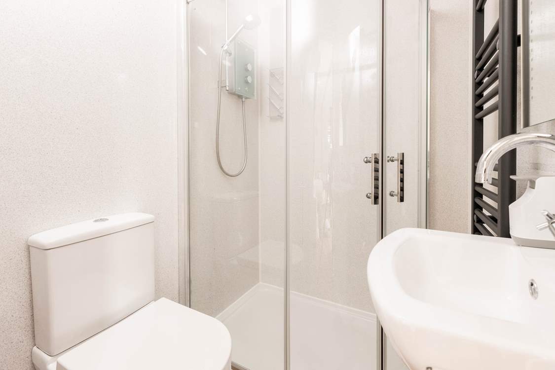 Head through to the sleek, stylish shower-room.