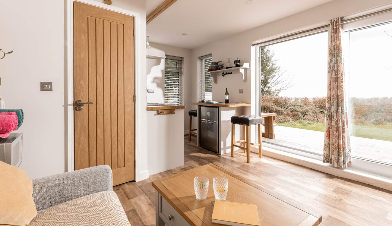 Open up the large door and allow fresh air to flow throughout the hideaway.