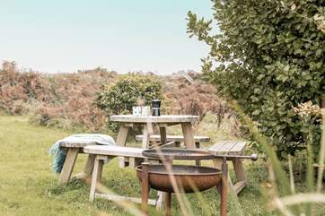 Light the rustic firepit and stay cosy until the moon and stars appear.