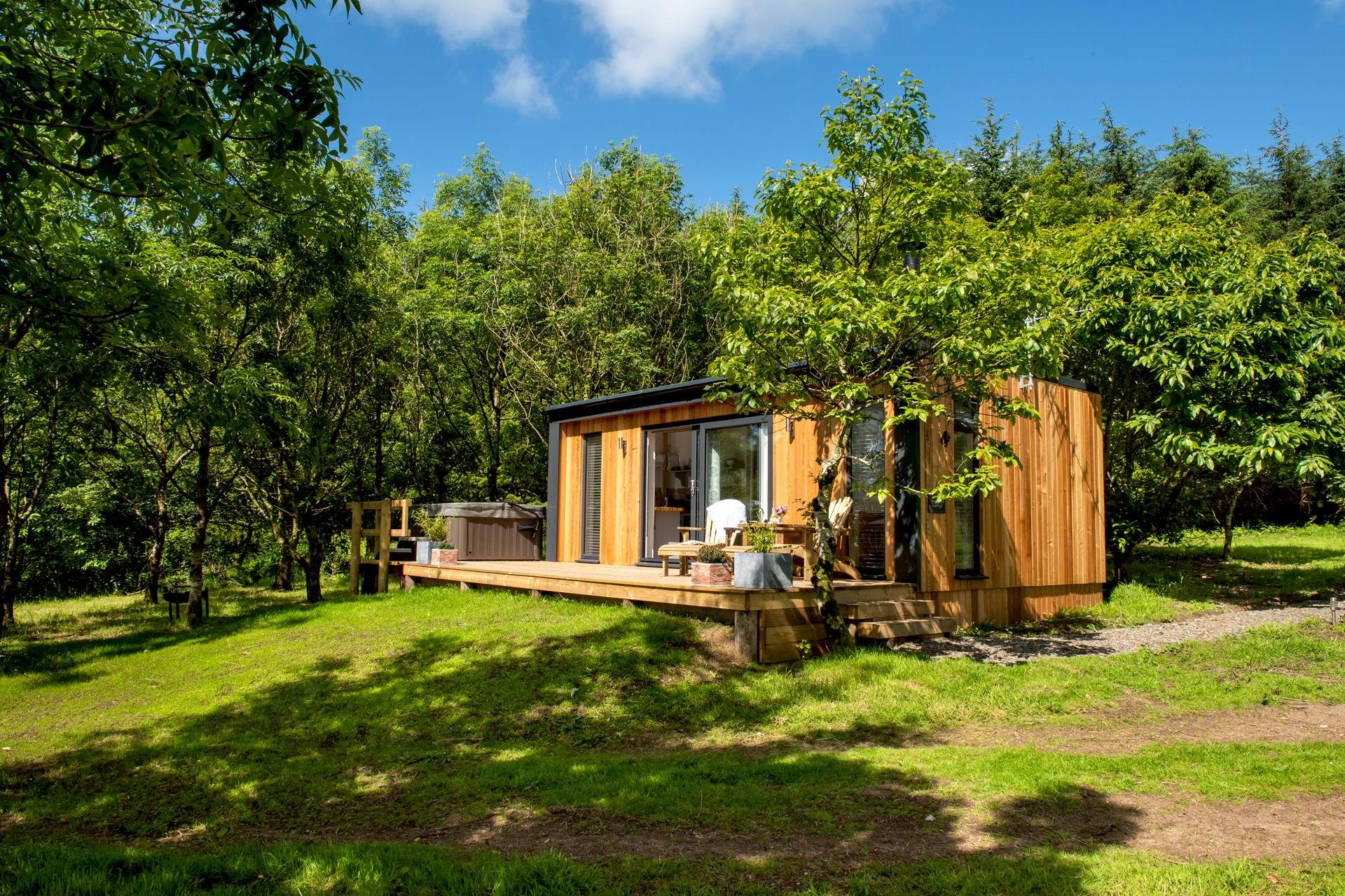 There are stunning far-reaching views over countryside out to the sea in the distance.