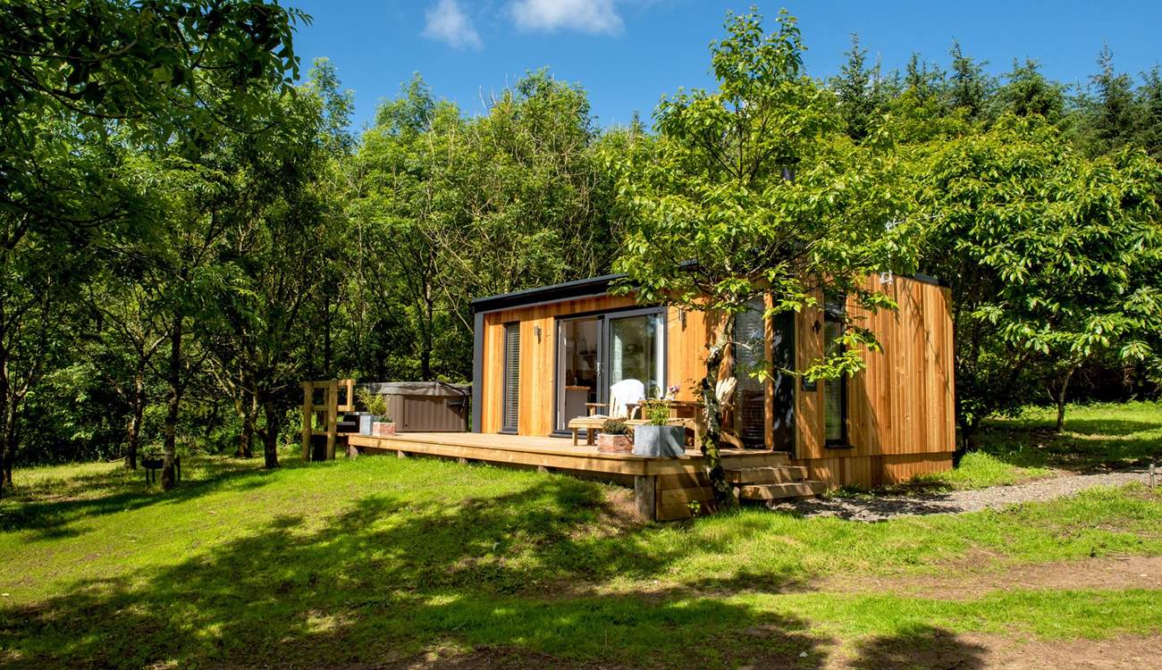 There are stunning far-reaching views over countryside out to the sea in the distance.