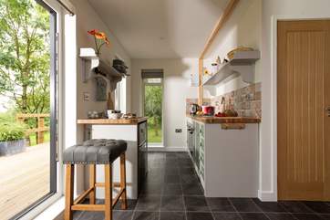 Looking towards the kitchen-area also with full length windows to maximise the view.