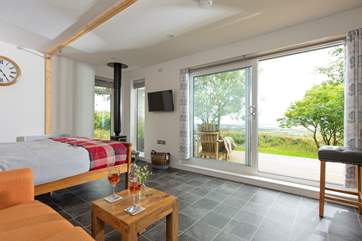 The living area is spacious, with sliding patio doors to enhance the view and allow the natural light in.