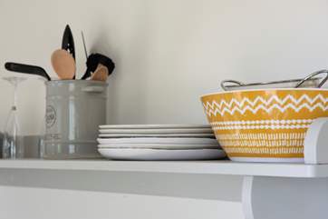 Lovely coloured pieces add to the charm of this contemporary space.