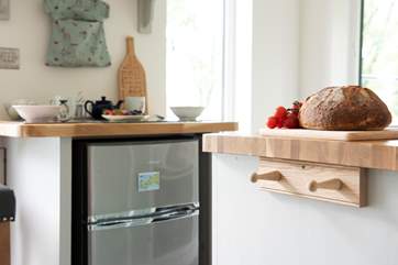 There is even a fridge with small freezer cleverly tucked away.
