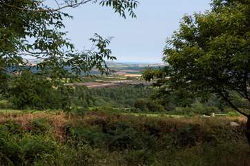 Miles of countryside to be seen from this special spot with the coast and sea beyond.