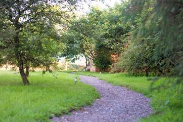 Tucked into the edge of the woodland is Squirrel Nutkin.