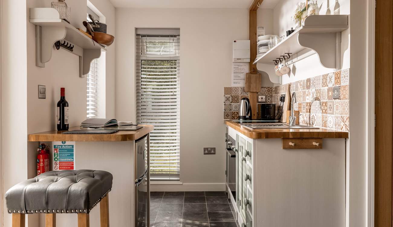 The superbly equipped kitchen, decorated with an array of stunning tiles.