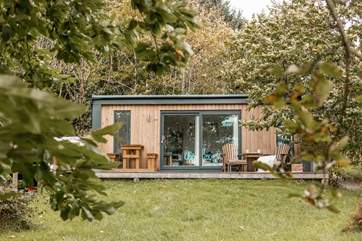 Tucked away in a peaceful pocket of woodland...