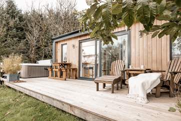 The large decking offers plenty of sunlit spots.