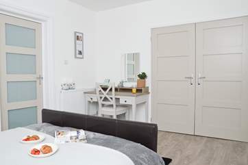 Storage and comfort in the double bedroom.