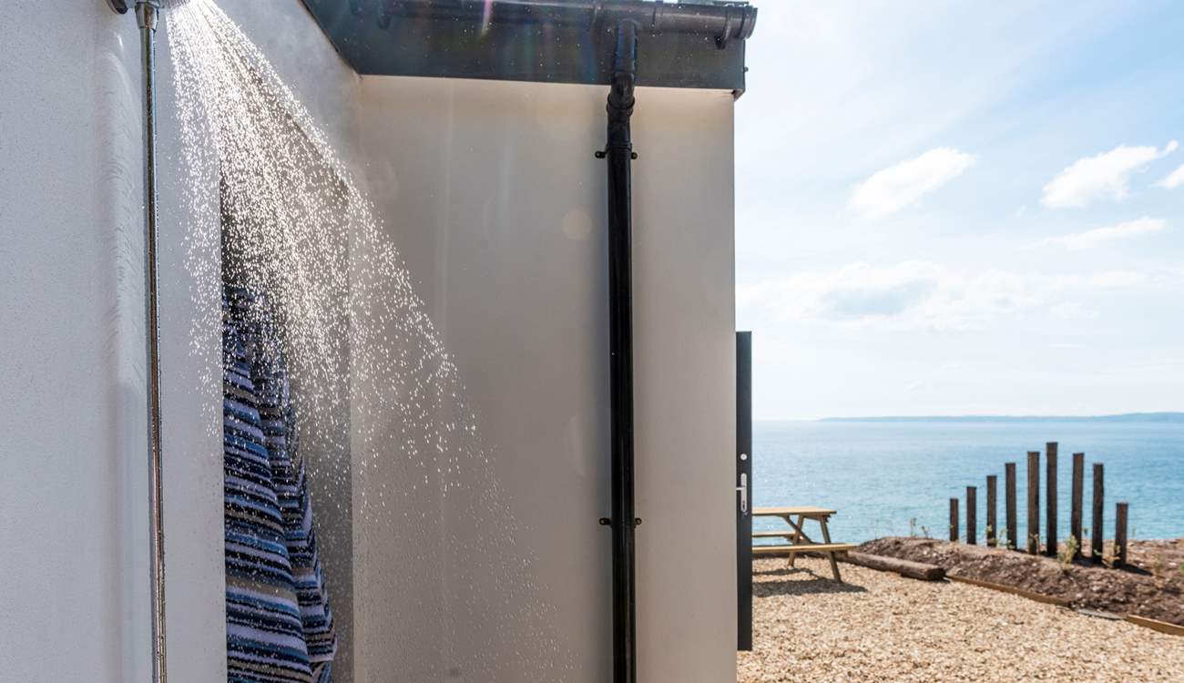 The outdoor shower is ideal for rinsing off sandy dogs and bodies.