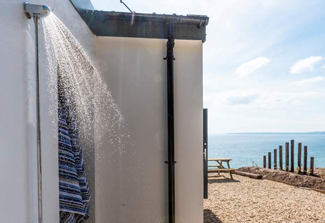 The outdoor shower is ideal for rinsing off sandy dogs and bodies.
