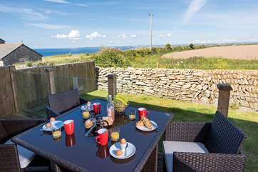 Relax on the terrace and take in the sea views.