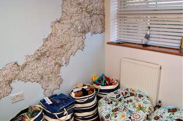 The snug has a fabulous feature wall of Cornwall and loads of games to keep children and adults alike, amused.