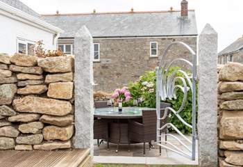 The outside dining area has been created with beautifully crafted stone-work.