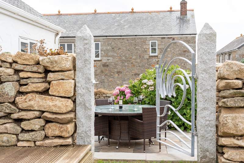 The outside dining area has been created with beautifully crafted stone-work.