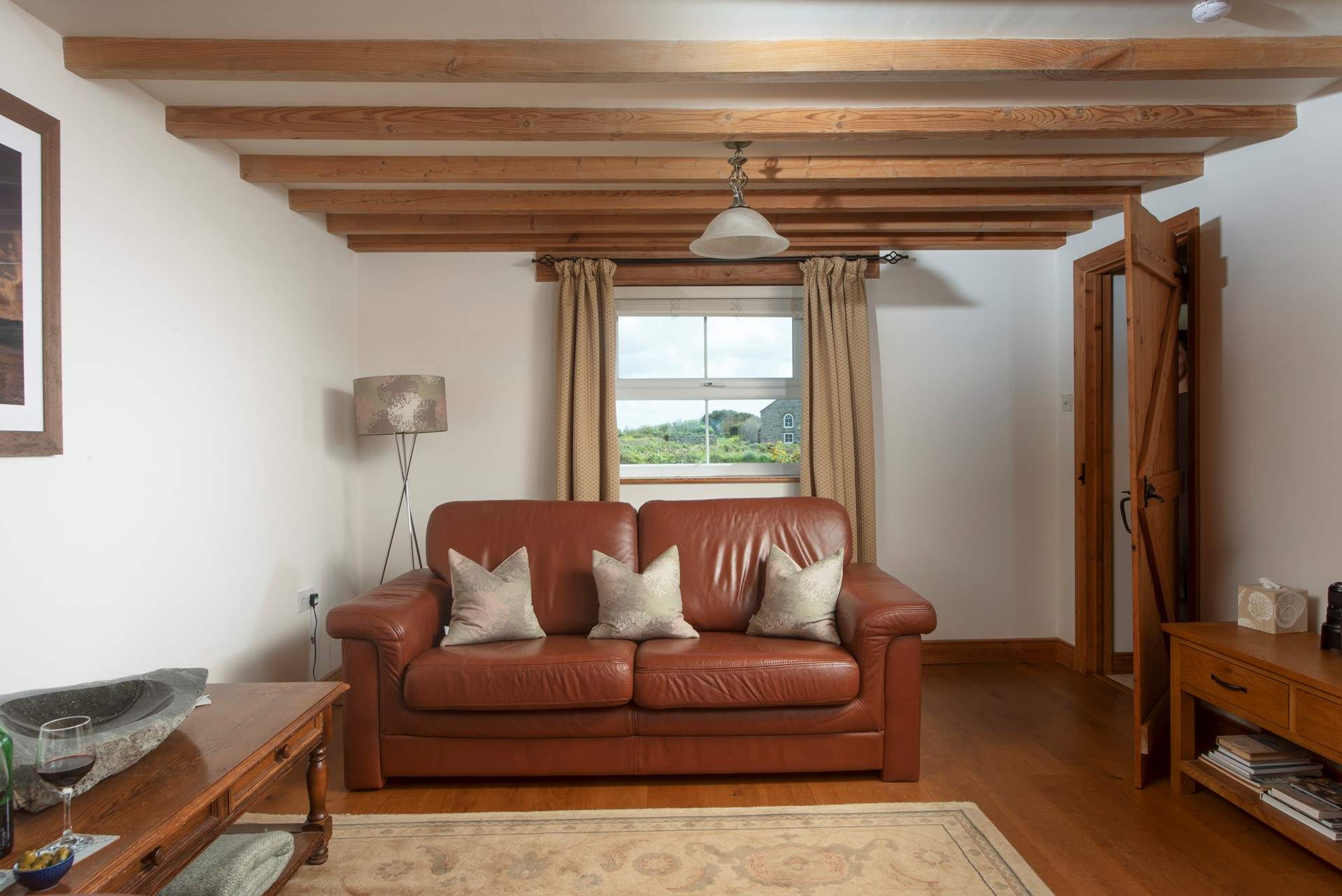 The sitting-room has countryside views one way, and sea views the other.