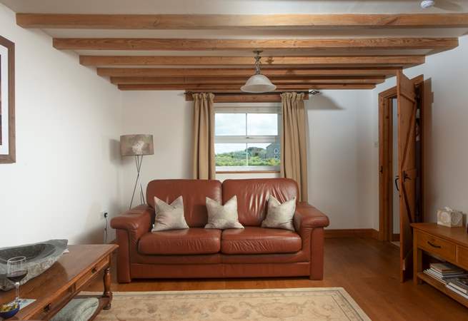 The sitting-room has countryside views one way, and sea views the other.