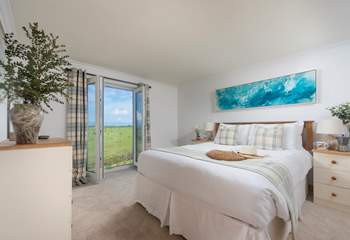 The en suite bedroom has a lovely Juliette balcony to make the most of the stunning views,