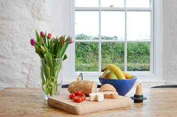 Convivial living and meals around a traditional farmhouse table.