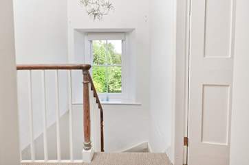 Stairs run up through the centre of the house.