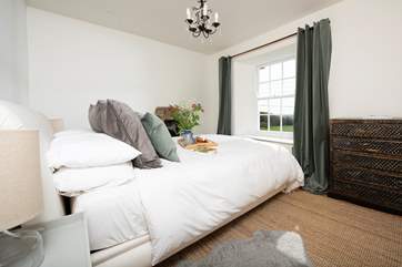 The second double bedroom has a king-size bed and lovely views towards to the sea.