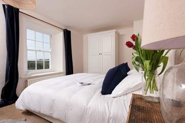 The first floor master bedroom with a super-king size bed.