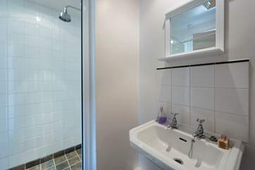 The ground floor shower-room which is set next to the utility-room.