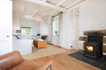 A warming wood-burner roars away in the sitting-room.