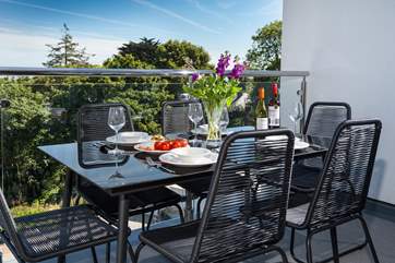 The balcony is a gorgeous space to relax and eat al fresco.