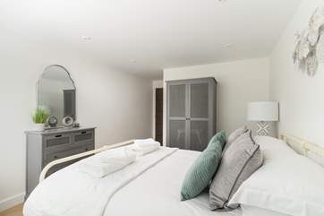 The main bedroom has a super comfy king size bed.