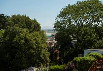 Take a peak at the golden stretch of sand through the trees.