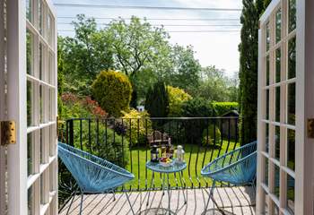 French doors open out to the granite terrace and garden.