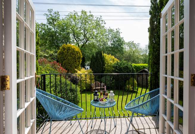 French doors open out to the granite terrace and garden.