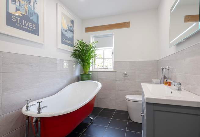 Enjoy a relaxing soak in the roll-top bath.