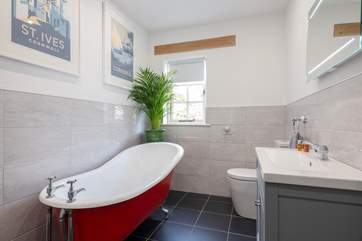Enjoy a relaxing soak in the roll-top bath.