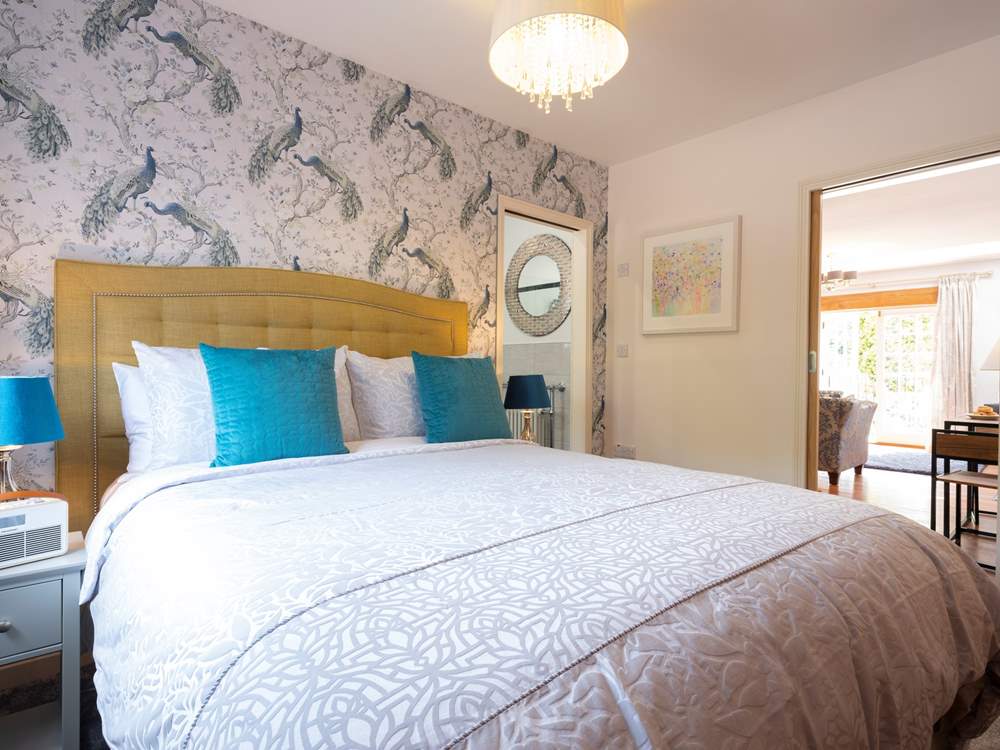 Looking through to the en suite bathroom and living-room.