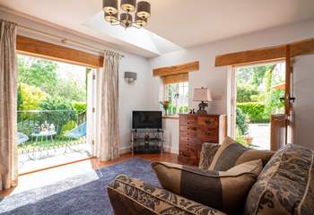 The sun streams in through the doors.