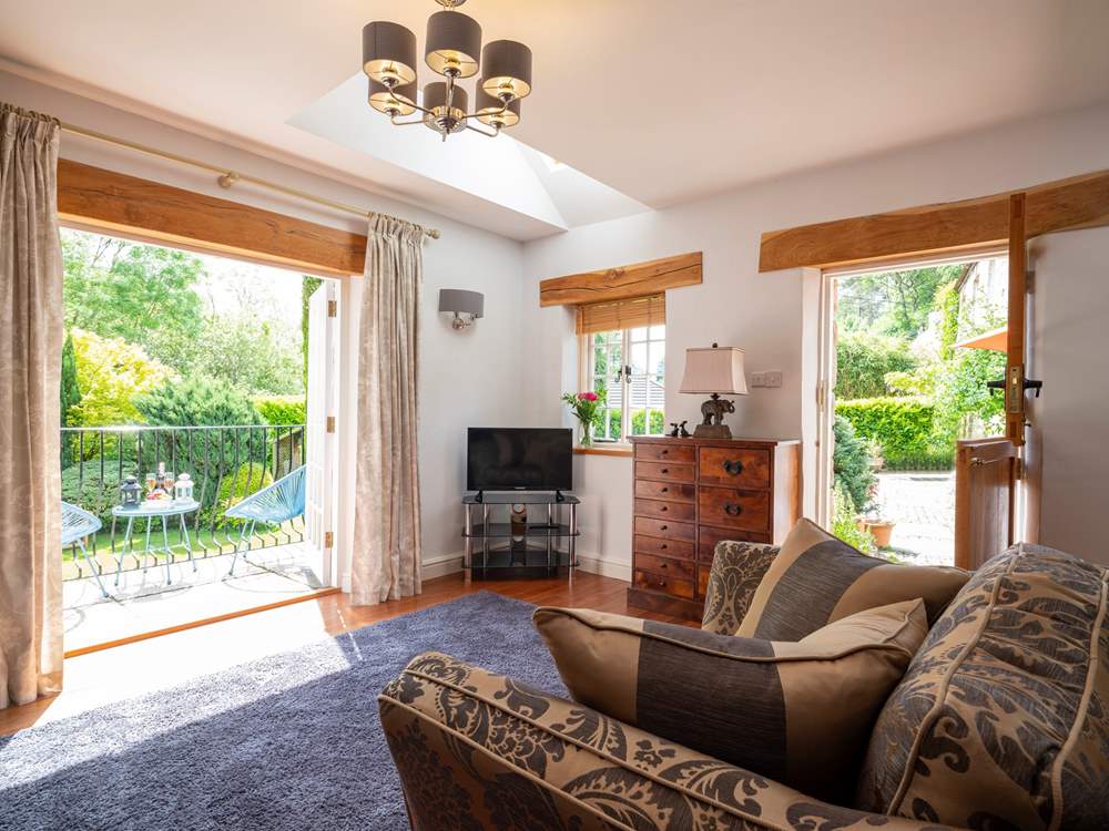 The sun streams in through the doors.