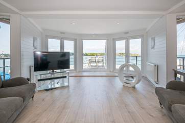 The open, bright living space affords guests a generous space to enjoy.