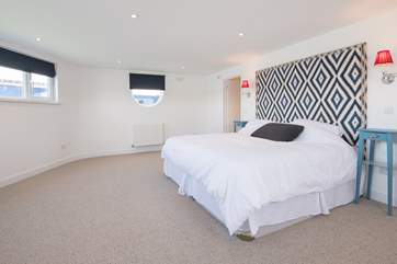 The master bedroom has a huge emperor bed and a walk-in wardrobe.