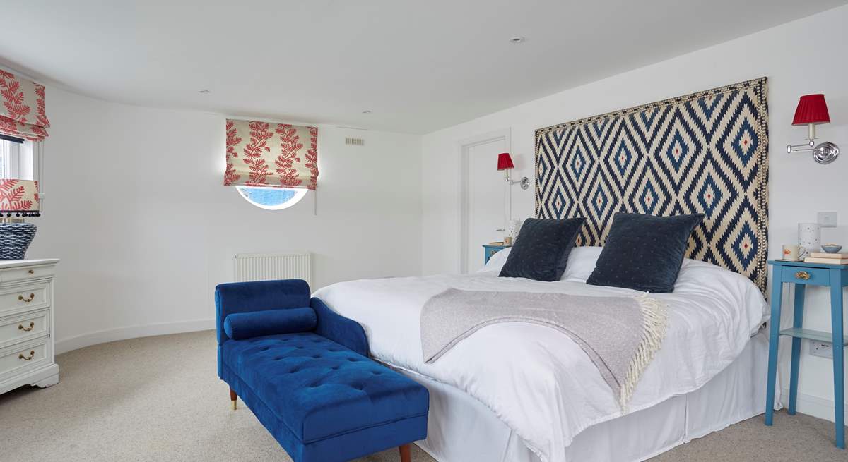 The main bedroom has a super-king bed and en suite bathroom with bath and shower cubicle. 