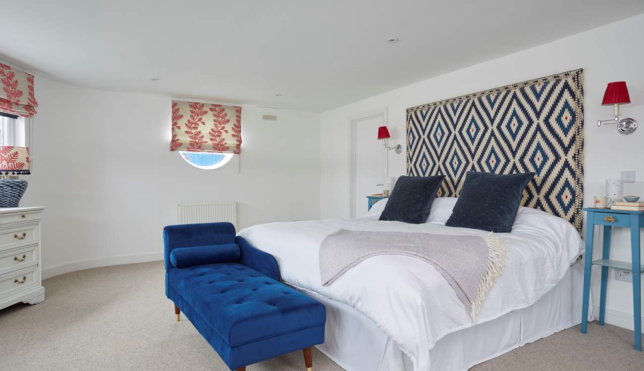 The main bedroom has a super-king bed and en suite bathroom with bath and shower cubicle. 