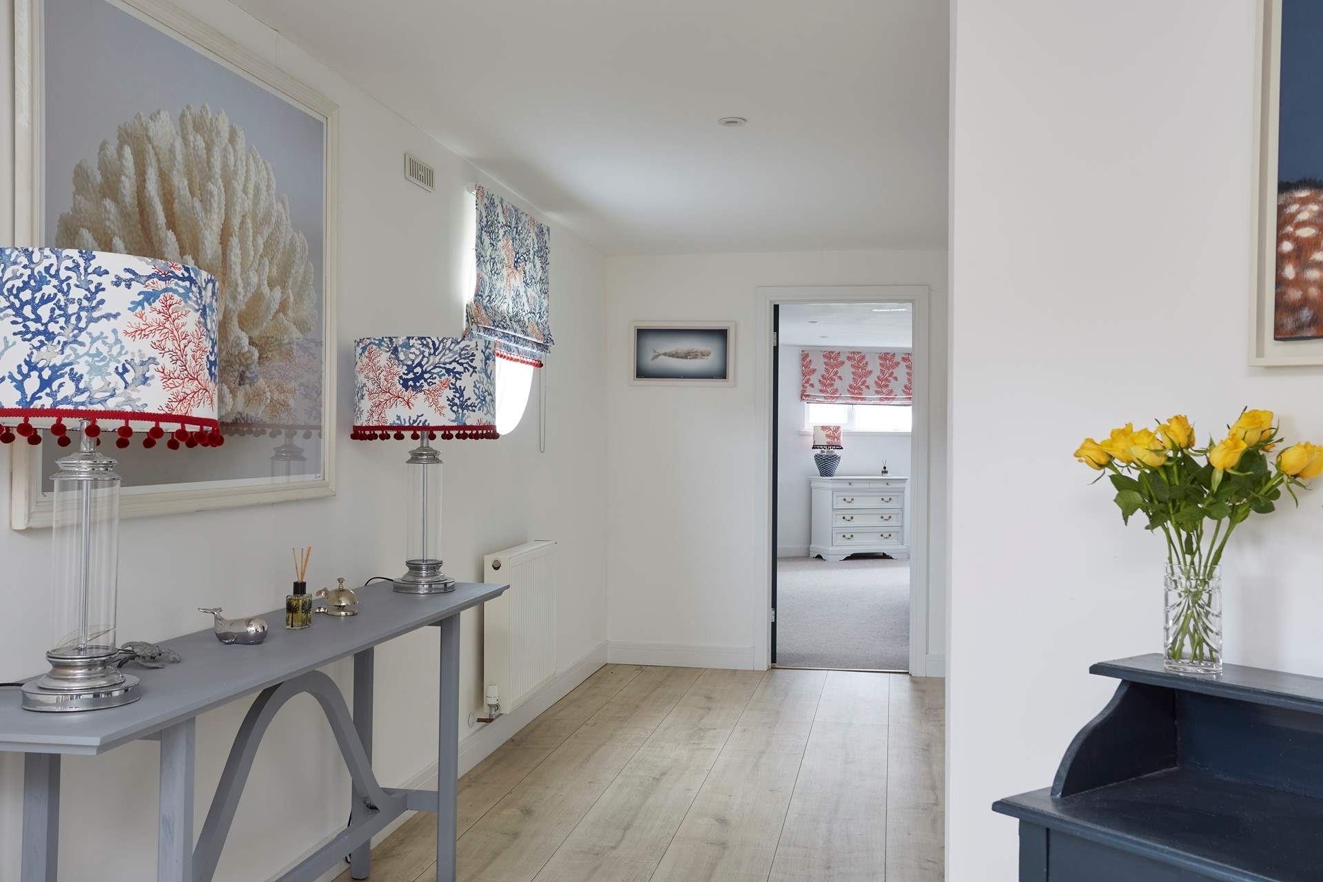 Access to the downstairs bedrooms is from a staircase in the entrance hallway.